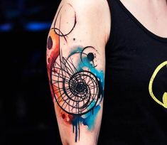 a woman with a tattoo on her arm has a batman symbol painted on the sleeve