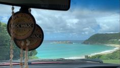 the view from inside a car looking out at an ocean