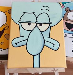 three cartoon characters painted on canvases in different colors