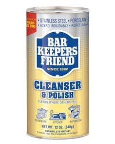 a can of cleaner and polish sitting on top of a white tablecloth with the words bar keepers friend