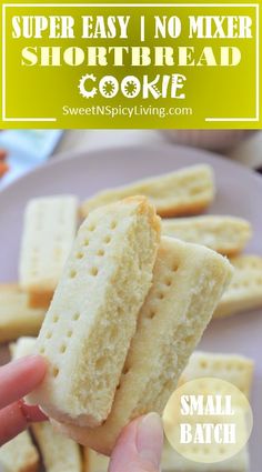 someone is holding up some shortbread crackers on a purple plate with the words, super easy no mixer shortbread cookie