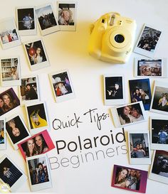 a polaroid camera sitting on top of a table next to pictures and magnets