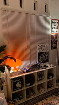 a living room with various items on the shelves