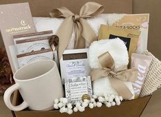 a gift box filled with coffee, tea and other items for someone's special occasion