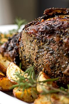 a close up of a plate of food with meat and potatoes