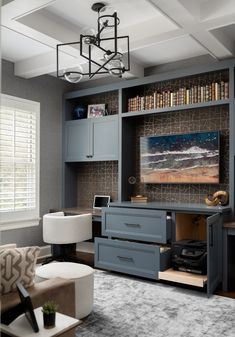 a living room filled with furniture and bookshelves