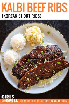 korean short ribs served with rice and green onions on a white plate in front of a black background