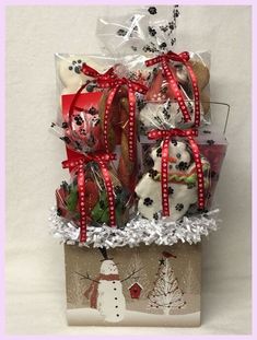 a gift basket filled with cookies and candies for someone's special christmas occasion