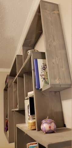 the shelves are made out of wood and have bookshelves attached to each other