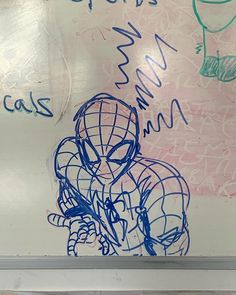 a drawing of a spider man on a whiteboard with writing underneath it that says spiderman