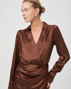 Made from 100% silk satin, the Nyla dress is a flattering long sleeve faux-wrap mini dress that features a collar with a v-neckline. This chic brown dress will be your new favorite date night staple. | Nyla Dress - Landslide Silk Satin | Size 14 Chic V-neck Satin Dress For Fall, Silk V-neck Mini Dress For Work, Chic Long Sleeve Satin Mini Dress, Long Sleeve Satin Mini Dress For Fall, Chic Silk V-neck Mini Dress, Long Sleeve Satin Mini Dress For Office, Long Sleeve Satin Mini Dress For Work, Sleek Long Sleeve Satin Dress For Date Night, Long Sleeve Satin Dress For Fall Date Night