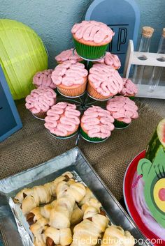 there are many cupcakes and muffins on the table