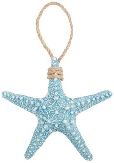 a blue starfish ornament hanging from a rope