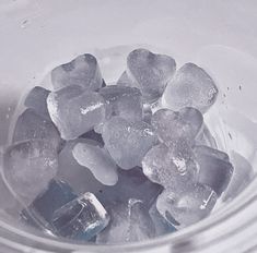 some ice cubes are in a glass bowl