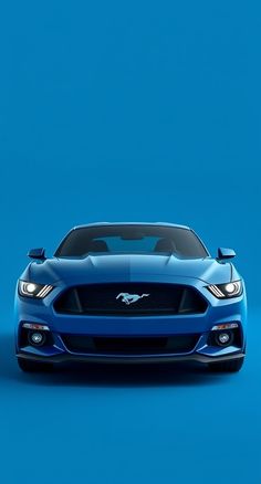 the front end of a blue sports car on a blue background with no one around it