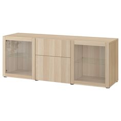 a large wooden cabinet with glass doors on the front and bottom shelves in light wood