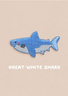 a blue and white shark with the words great white shark on it's back