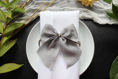 Pure silk bow tie/pure silk bow/table decoration/silky way bow napkin rings/grey napkin rings Handmade bow ties in 100% pure silk. Can serve as an excellent decoration for your table and for other decorative creativity Size: 10cm x 12cm Once your order is marked as sent, delivery time is estimated: France 48 - 72h EU 3 - 6 days Non-EU Europe 6 - 11 days United States 3 - 20 days Australia 5 - 15 days Canada 5 - 15 days Great Britain 3 - 5 days Puerto Rico 6 - 7 days New Zealand 6 - 9 days Japan Bow Napkin, Silk Gifts, Rings Handmade, Silk Bow Ties, Silk Bow, Knot Ring, Handmade Bows, Wedding Item, Table Decoration