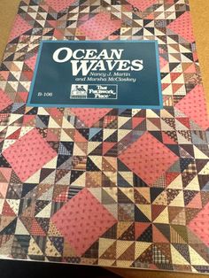 the book ocean waves is sitting on a table