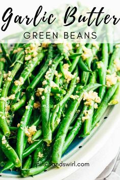 garlic butter green beans on a plate with text overlay that reads garlic butter green beans