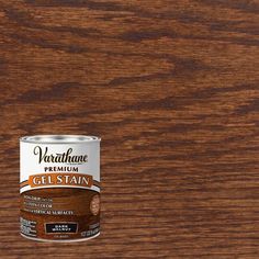 a can of stain and poly on a wooden surface