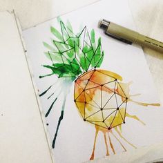 a drawing of a pineapple on a piece of paper next to a fountain pen