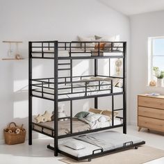 a bunk bed sitting in the middle of a room next to a dresser and window