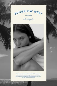 a black and white photo of a woman with her arms crossed in front of a palm tree