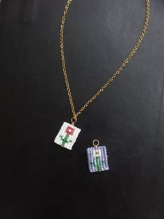 a necklace with an image of a nintendo game on it