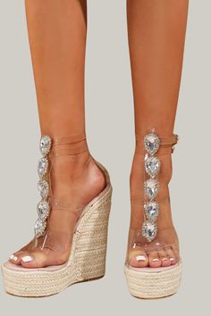 Indulge in the ultimate luxury with these Women's High Heel Sandals adorned with sparkling rhinestone chains. Featuring a jute sole and transparent heel, these sandals exude a bold and fashionable vibe. Perfect for any vacation, these sandals have an open toe design, a simple yet elegant pattern, and an ankle strap for added support. The wedge heels measure an ultra high 15cm/5.9 inches, while the upper and lining materials are made of premium PVC. Step out in style and comfort with these exclus Glamorous Clear Sandals For Summer, Crystal Open Toe Heels For Summer, Summer Crystal Heels With Rhinestones, Summer Crystal High Heels, Summer Rhinestone Heels, High Heel Rhinestone Beach Sandals, Rhinestone High Heel Sandals For Beach, Spring Crystal Open Toe Sandals, Crystal Embellished Heels For Summer