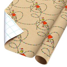 a christmas wrapping paper with an image of elves on it