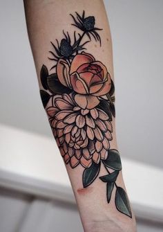 a person with a flower tattoo on their arm