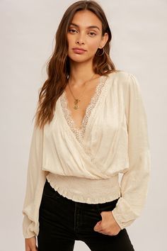 This Amir Blouse is ready to make some serious fashion waves! Crafted from a blend of rayon and polyester, the surplice lace-trimmed smock waist blouse is sure to add a classy and luxe touch to any outfit. Give your wardrobe an upgrade with this must-have piece! Swim Cover Up Dress, Style Steal, Crop Top Tees, Plus Size Sweaters, Satin Blouse, Style Mistakes, Fashion Fits, Blouse Fabric, Cover Up Dress