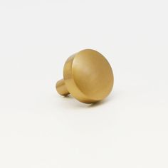 an image of a brass knob on a white background