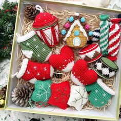 a box filled with knitted christmas ornaments