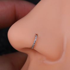 a close up view of a fake nose with a ring on it's side