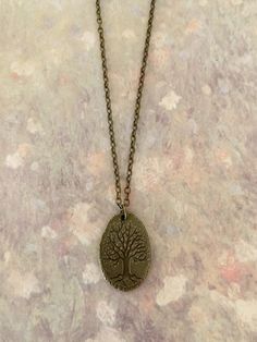 "Bronze double sided tree necklace features carved tree on oval tree slice look design, life tree necklace, tree of life jewelry, tree slice, tree necklace, bark necklace, arborist gifts, tree lover gift Pendant measures 1\" L X 5/8' W and is on an 18\" chain. ★ Want to see more?  Please visit my shop at: https://www.etsy.com/shop/DesignsByPeg" Carved Tree, Tree Slice, Necklace Tree, Life Jewelry, Tree Of Life Jewelry, Tree Lover, Tree Slices, Life Tree, Tree Carving