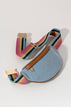 Keep everything you need right in reach with Shiraleah's Ali Belt Bag. Made from classic denim fabric with a rainbow colored belt strap, this bag can wrap around your waist or be slung fashionably across the body. The mix of colors with denim allows this bag to work with any of your favorite summer outfits. Pair with other items from Shiraleah to complete your look! Summer Outfits Cotton, Fall Handbags, Denim Belt, Strap Tops, Adjustable Belt, A Rainbow, Denim Fabric, Vintage Charms, Lifestyle Brands