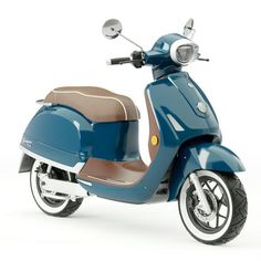 a blue scooter is parked on a white surface and it's brown seat