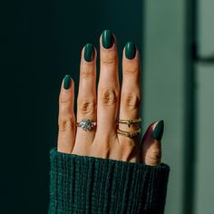 Modern dark nail design ideas with dark green marble accents