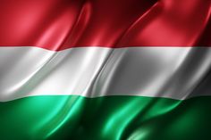 the hungarian flag is waving in the wind and it looks like silky fabric or silk