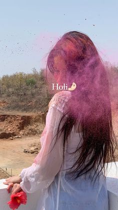 a woman with red hair and pink powder on her face is looking at the ground