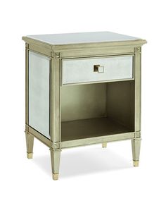 an antique style nightstand with mirrored doors and drawers on one side, two drawers on the other