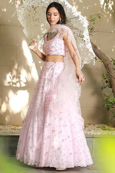 Blush Pink Net Embroidered Lehenga Set Featuring a blush pink lehenga in net base with cutdana and sequins hand embroidery. It is paired with a matching blouse, a cancan and a dupatta. This product will be shipped to you after 1-2 weeks from the date of order placed. All custom made orders are not returnable. Pls contact for Size chart and for other more colors Request You :To provide contact details for courier services. {VARIATION MAY COME DEPENDING UPON AVALIBILITY OF LACES OR GOTTA PATI} NOTE:  1) Visual Samples on website may differ slightly from actual product due to light & effects during photography (Length & Breadth have 1 n 1.5 inches  +/-). 2) Before placing order ,pls confirm product n color availability on +91 7903893945 & +91 8447750028(WhatsApp) 3) For Wholesale Order MOQ is Pink Organza Sets For Navratri, Pink Organza Choli For Navratri, Pink Organza Choli With Resham Embroidery, Pink Organza Lehenga For Navratri, Pink Net Dresses For Designer Wear, Pink Organza Choli With Dori Work, Pink Organza Lehenga With Zari Work, Pink Lehenga With Sheer Dupatta For Eid, Pink Semi-stitched Embroidered Fabric With Sheer Dupatta