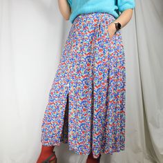 "Vintage Bright Ditsy Floral Print High Waist Button down Maxi Skirt WITH POCKETS  - Lovely high waist maxi skirt - Brand: Jackpot, Designed in Denmark, Made in India - Ditsy floral pattern, button closure, pockets - Zipper closure - 100% viscose - Great condition  - Estimated size S, tag size 1 Look for more skirts in my shop: https://www.etsy.com/shop/GoodGrooves?ref=seller-platform-mcnav§ion_id=39276826 ✿ MEASUREMENTS (taken flat) ✿ 39.5\" / 100 cm length 14'' / 35 cm waist (double for circumference) This is true vintage, so it's an item with experience. :) Item color on the pictures may vary due to monitor settings and light reflections. If you have any kind of question about the item I will be happy to answer! ☺" Long Skirt With Pockets For Daywear, Summer Wide Leg Maxi Skirt With Button Closure, Spring Long Skirt With Buttons, Spring Maxi Skirt With Pockets For Daywear, Spring Full Length Maxi Skirt With Pockets, Long Skirt With Button Closure For Spring, High Waist Multicolor Pleated Skirt, Spring Multicolor Bottoms With Buttons, Blue Long Skirt For Daywear