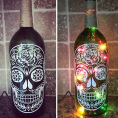 two bottles with lights in them and one has a skull on it