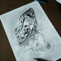 a drawing of a diamond on paper