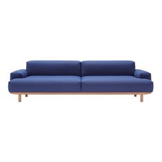 a blue couch sitting on top of a white floor