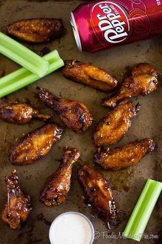 chicken wings and celery sticks with diet coke