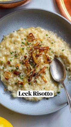 a bowl filled with risotto and topped with parmesan cheese